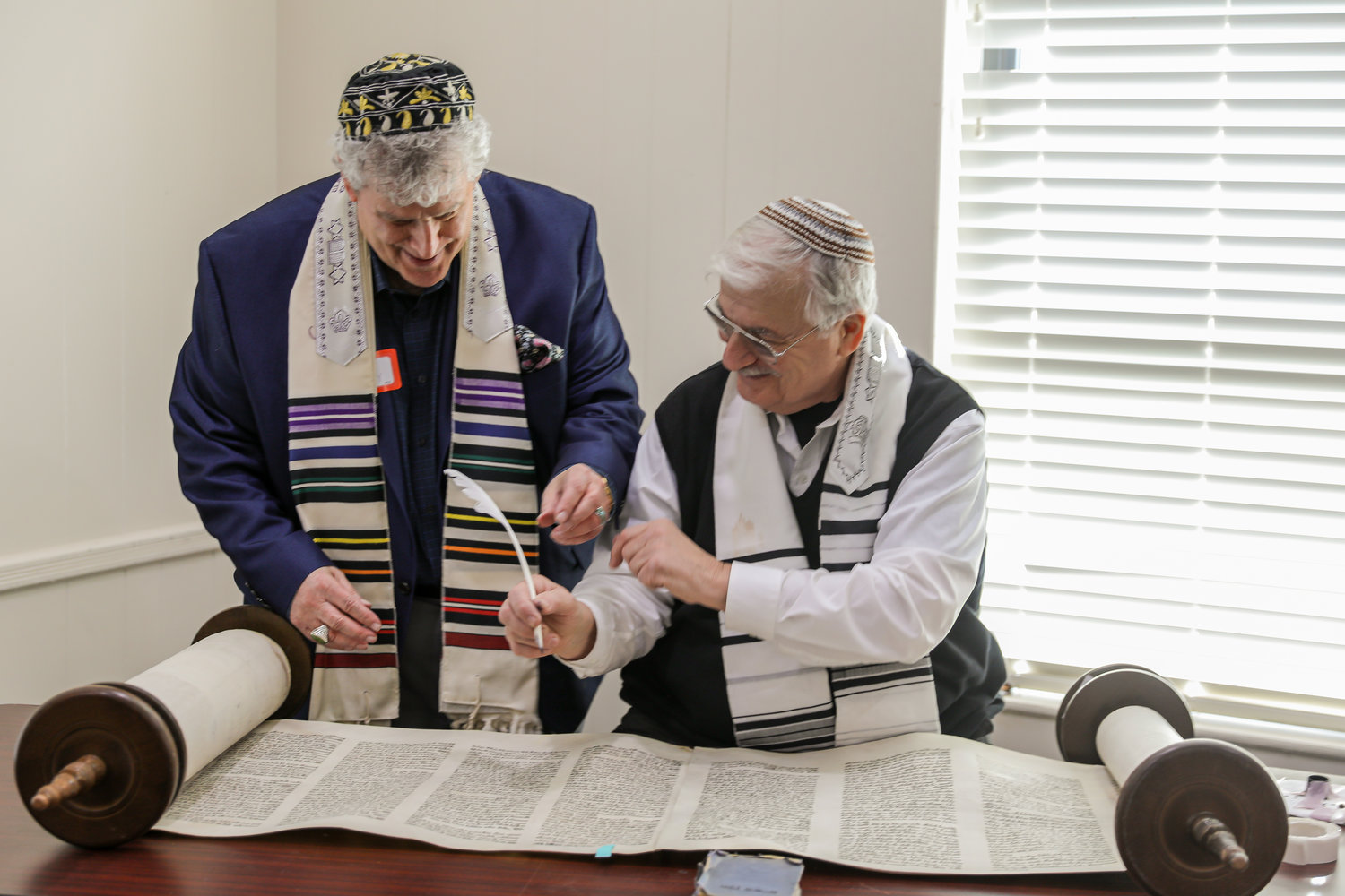 World-renowned sofer Neil H. Yerman conducted the event with congregation member Ed Paley.